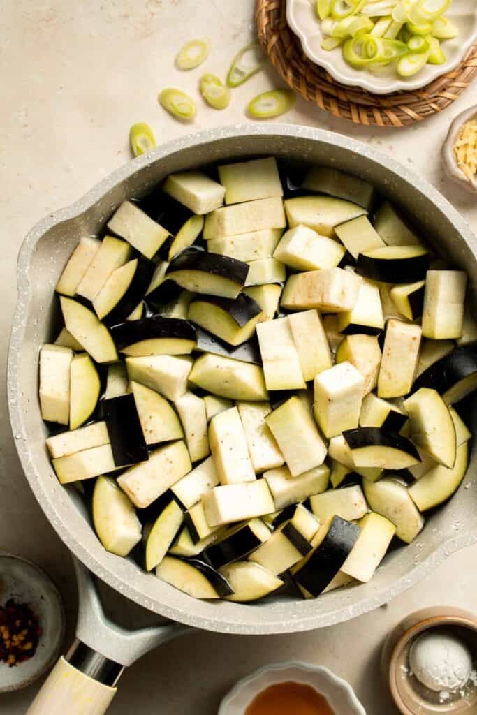 Quick and flavorful, this Chinese Eggplant Stir Fry is packed with garlic, ginger, and savory sauce. Perfect for rice or noodles! | aheadofthyme.com