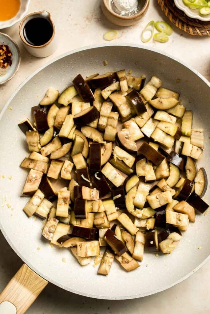 Quick and flavorful, this Chinese Eggplant Stir Fry is packed with garlic, ginger, and savory sauce. Perfect for rice or noodles! | aheadofthyme.com