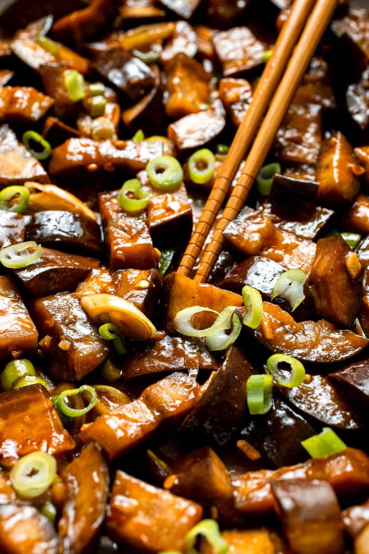 Quick and flavorful, this Chinese Eggplant Stir Fry is packed with garlic, ginger, and savory sauce. Perfect for rice or noodles! | aheadofthyme.com