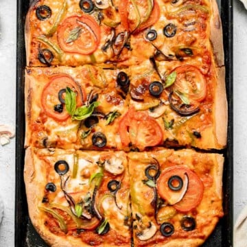 This Easy Sheet Pan Pizza recipe is perfect for a quick weeknight dinner. With its crispy crust and customizable toppings, it'll become a family favorite! | aheadofthyme.com