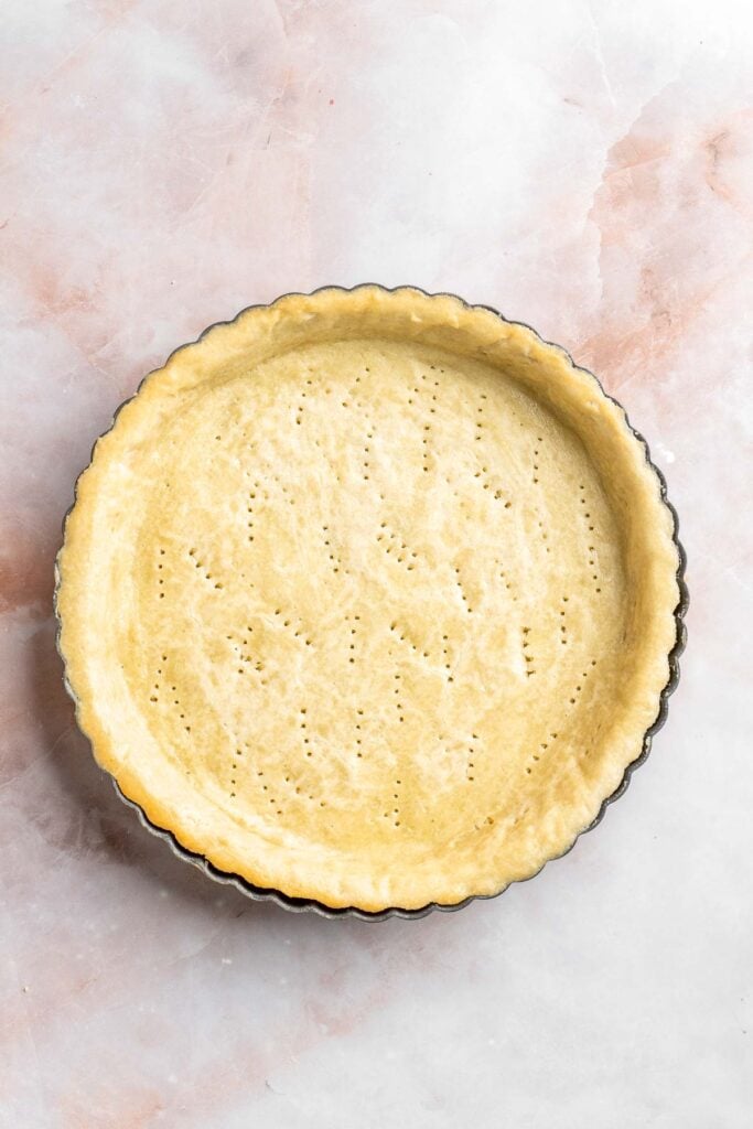 This French Lemon Tart features a crisp sable crust and silky lemon filling. It's perfectly tangy, smooth, and ideal for spring or summer gatherings. | aheadofthyme.com