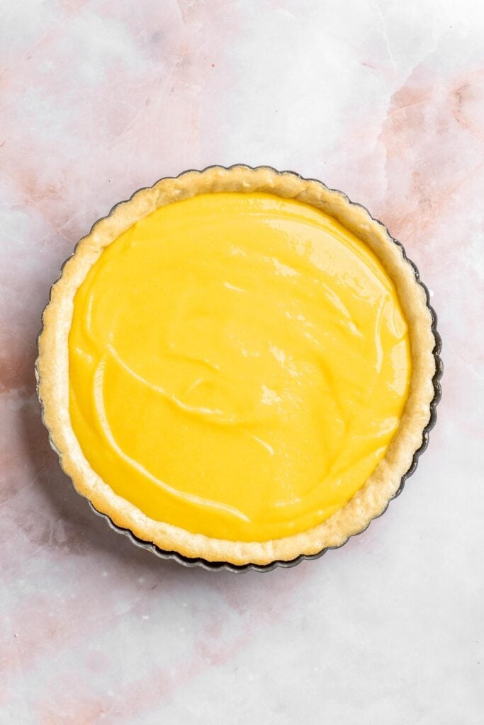 This French Lemon Tart features a crisp sable crust and silky lemon filling. It's perfectly tangy, smooth, and ideal for spring or summer gatherings. | aheadofthyme.com