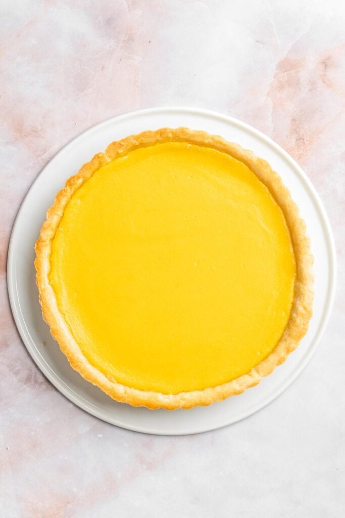 This French Lemon Tart features a crisp sable crust and silky lemon filling. It's perfectly tangy, smooth, and ideal for spring or summer gatherings. | aheadofthyme.com