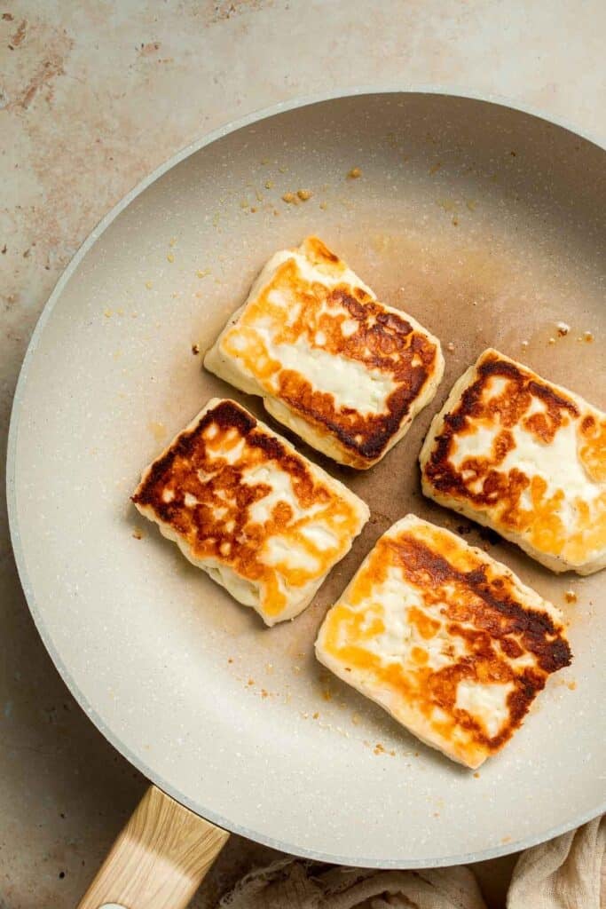 Halloumi Burgers are crispy, salty, and packed with Mediterranean flavor. A quick and easy vegetarian burger ready in 15 minutes! | aheadofthyme.com