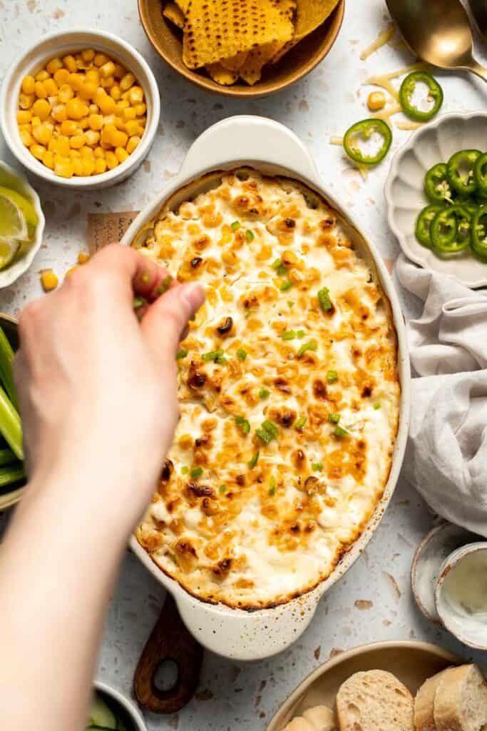 This creamy Mexican Street Corn Dip (Elote Dip) is packed with bold, tangy flavor and ready in just 25 minutes. Perfect for parties! | aheadofthyme.com