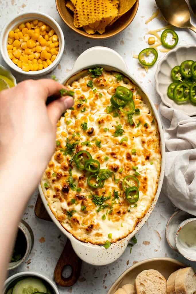 This creamy Mexican Street Corn Dip (Elote Dip) is packed with bold, tangy flavor and ready in just 25 minutes. Perfect for parties! | aheadofthyme.com