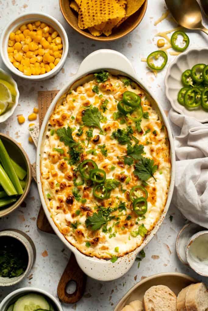 This creamy Mexican Street Corn Dip (Elote Dip) is packed with bold, tangy flavor and ready in just 25 minutes. Perfect for parties! | aheadofthyme.com