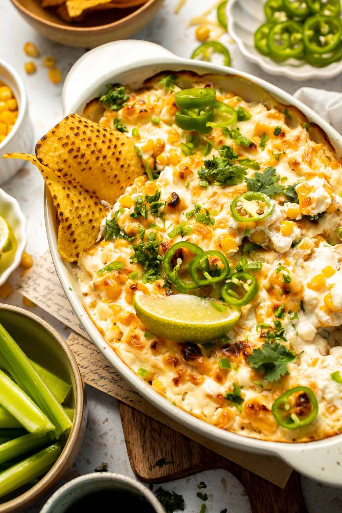 This creamy Mexican Street Corn Dip (Elote Dip) is packed with bold, tangy flavor and ready in just 25 minutes. Perfect for parties! | aheadofthyme.com