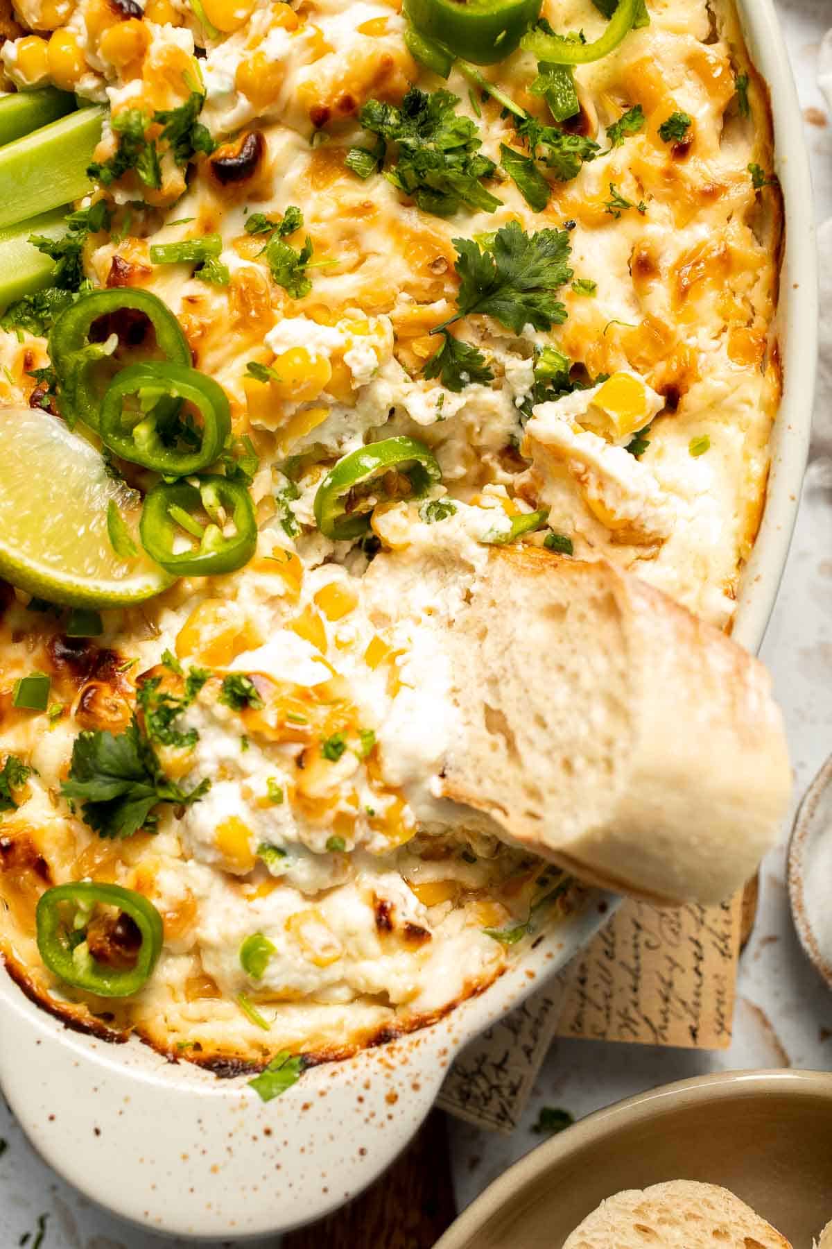 This creamy Mexican Street Corn Dip (Elote Dip) is packed with bold, tangy flavor and ready in just 25 minutes. Perfect for parties! | aheadofthyme.com