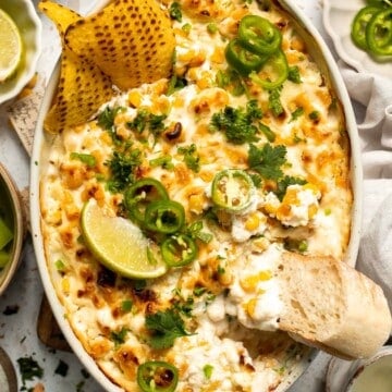 This creamy Mexican Street Corn Dip (Elote Dip) is packed with bold, tangy flavor and ready in just 25 minutes. Perfect for parties! | aheadofthyme.com
