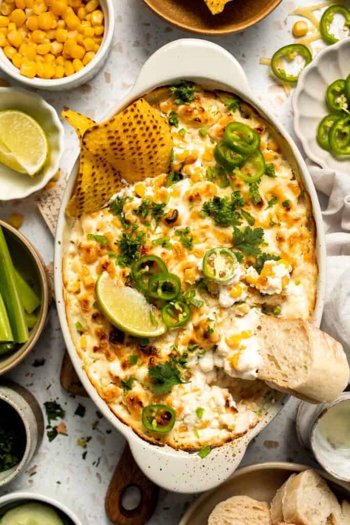 This creamy Mexican Street Corn Dip (Elote Dip) is packed with bold, tangy flavor and ready in just 25 minutes. Perfect for parties! | aheadofthyme.com