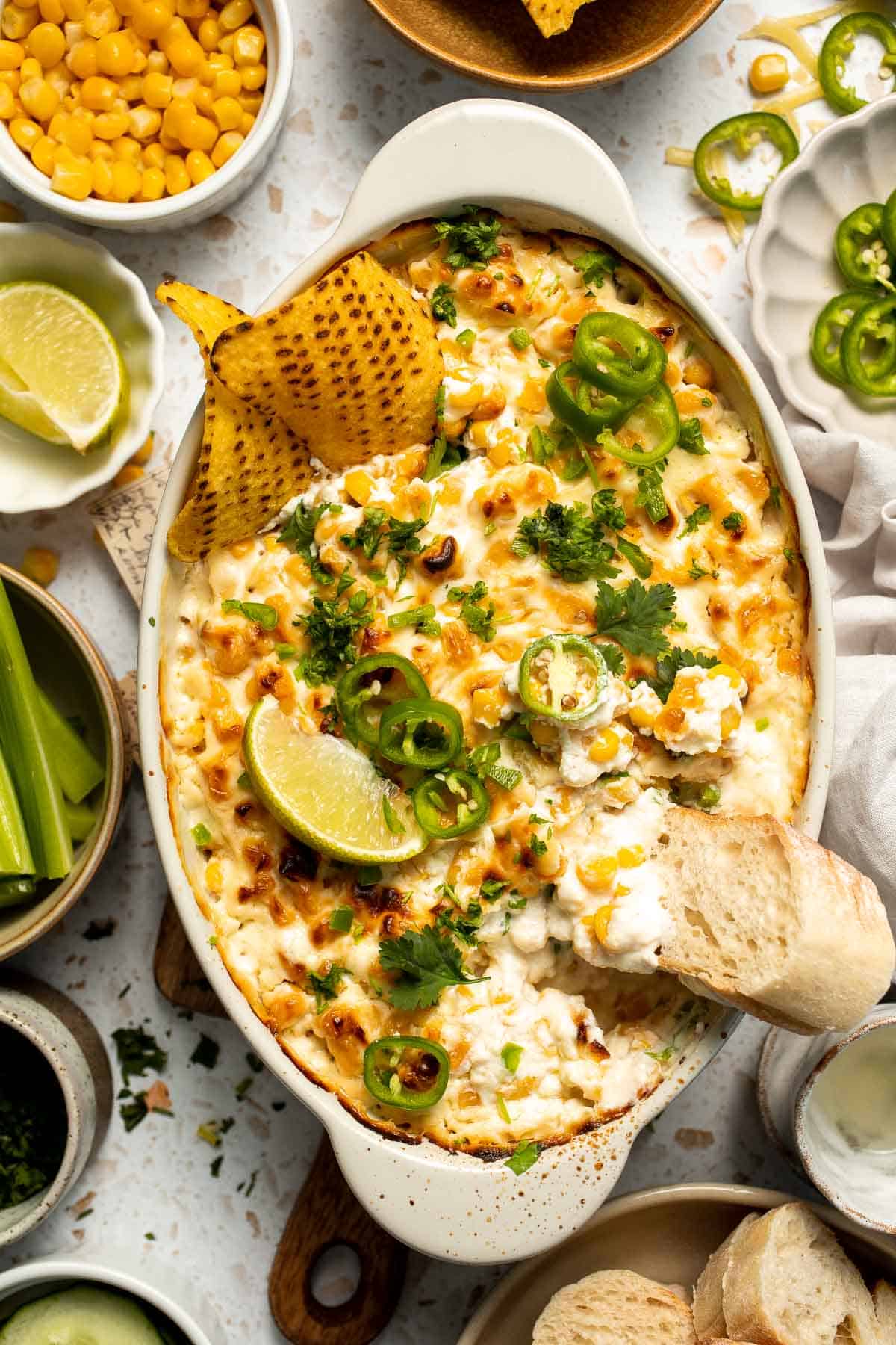 This creamy Mexican Street Corn Dip (Elote Dip) is packed with bold, tangy flavor and ready in just 25 minutes. Perfect for parties! | aheadofthyme.com