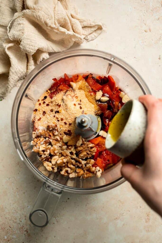 Muhammara is a delicious Middle Eastern dip made with roasted red peppers, walnuts, and spices. Perfect for dipping or spreading on sandwiches. | aheadofthyme.com