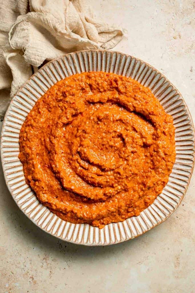 Muhammara is a delicious Middle Eastern dip made with roasted red peppers, walnuts, and spices. Perfect for dipping or spreading on sandwiches. | aheadofthyme.com