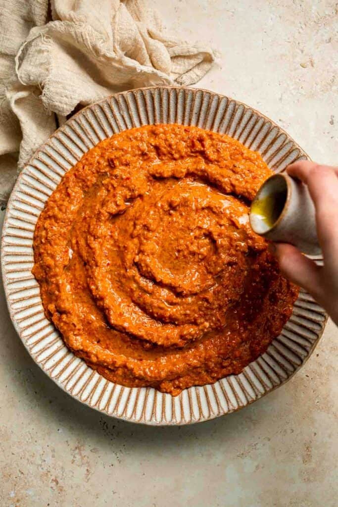 Muhammara is a delicious Middle Eastern dip made with roasted red peppers, walnuts, and spices. Perfect for dipping or spreading on sandwiches. | aheadofthyme.com