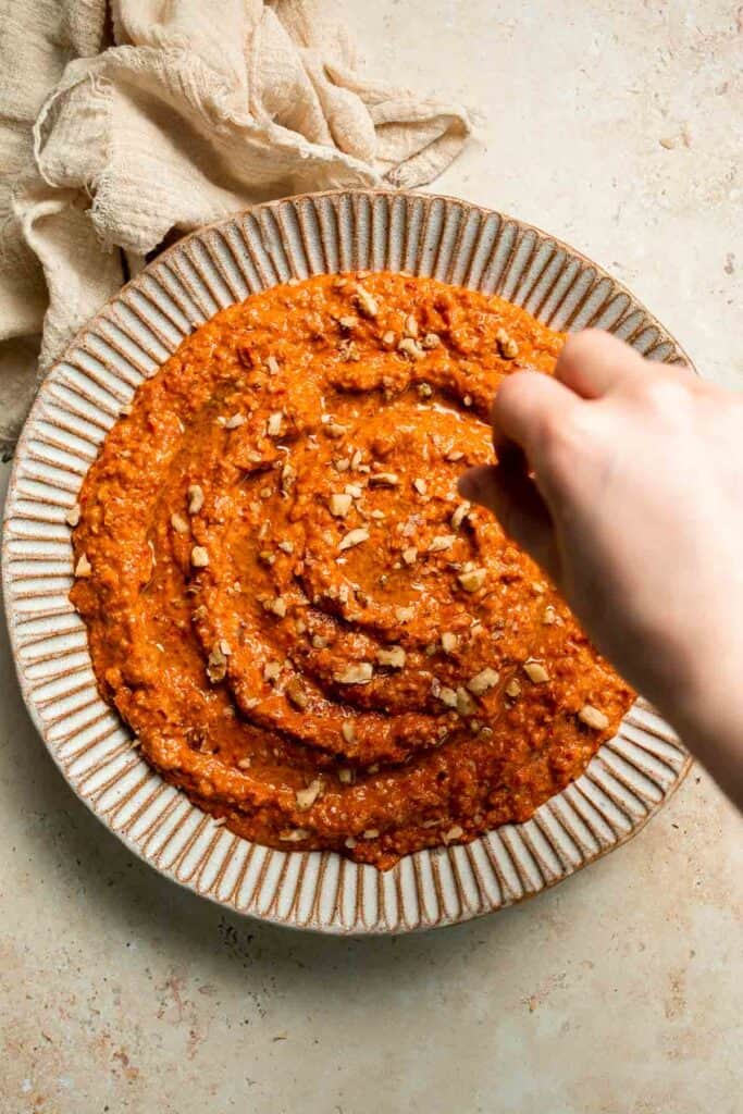 Muhammara is a delicious Middle Eastern dip made with roasted red peppers, walnuts, and spices. Perfect for dipping or spreading on sandwiches. | aheadofthyme.com