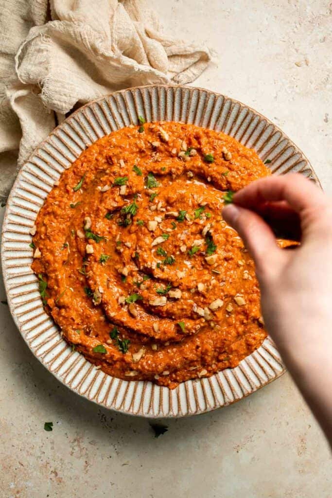 Muhammara is a delicious Middle Eastern dip made with roasted red peppers, walnuts, and spices. Perfect for dipping or spreading on sandwiches. | aheadofthyme.com