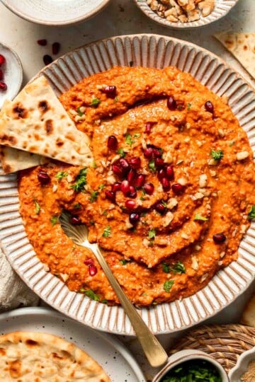 Muhammara is a delicious Middle Eastern dip made with roasted red peppers, walnuts, and spices. Perfect for dipping or spreading on sandwiches. | aheadofthyme.com