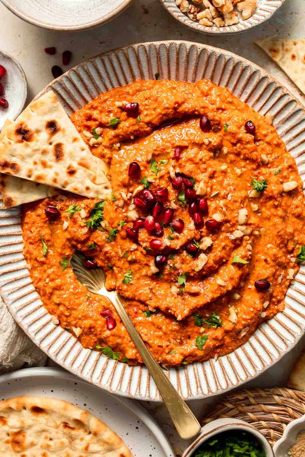 Muhammara is a delicious Middle Eastern dip made with roasted red peppers, walnuts, and spices. Perfect for dipping or spreading on sandwiches. | aheadofthyme.com