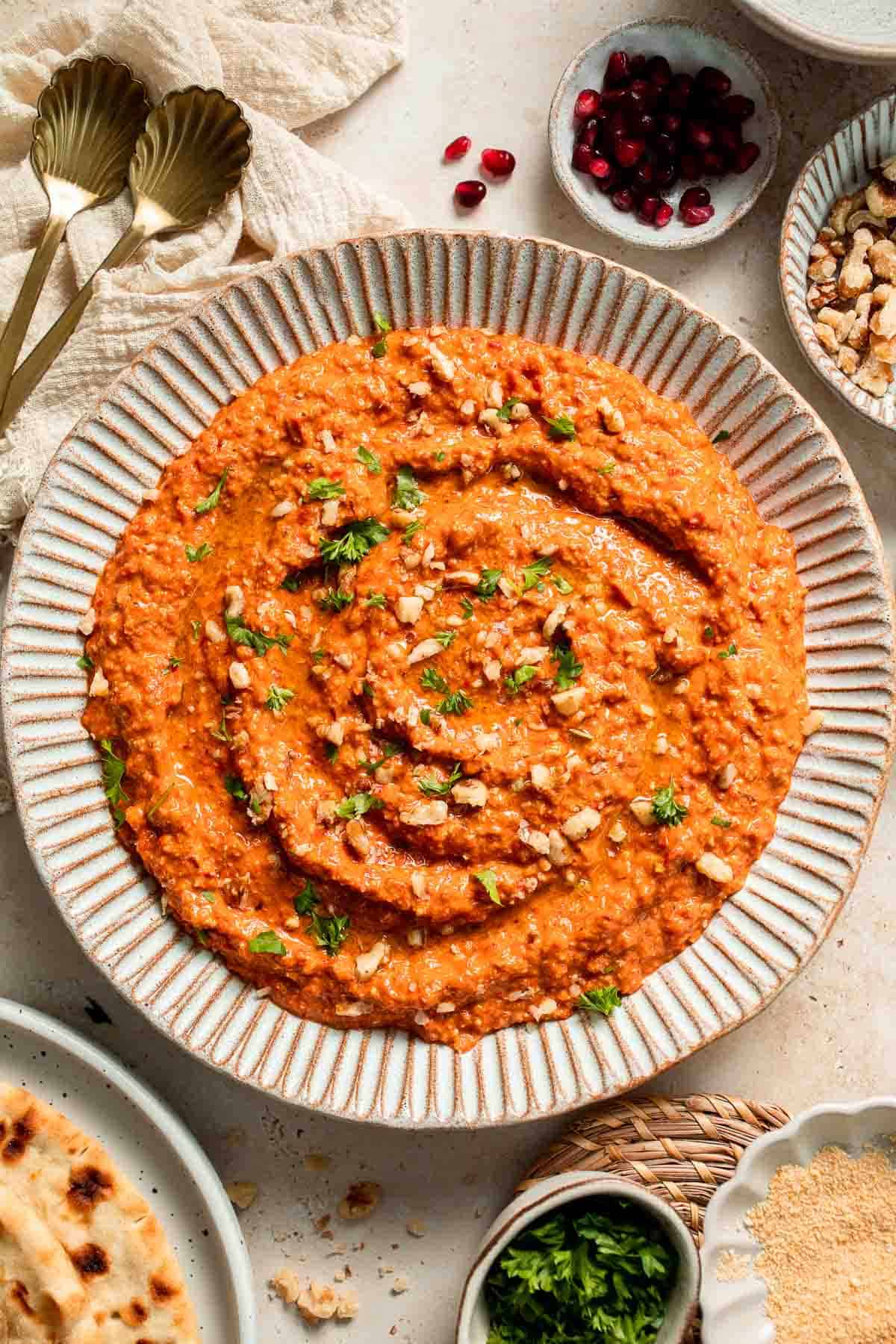 Muhammara is a delicious Middle Eastern dip made with roasted red peppers, walnuts, and spices. Perfect for dipping or spreading on sandwiches. | aheadofthyme.com