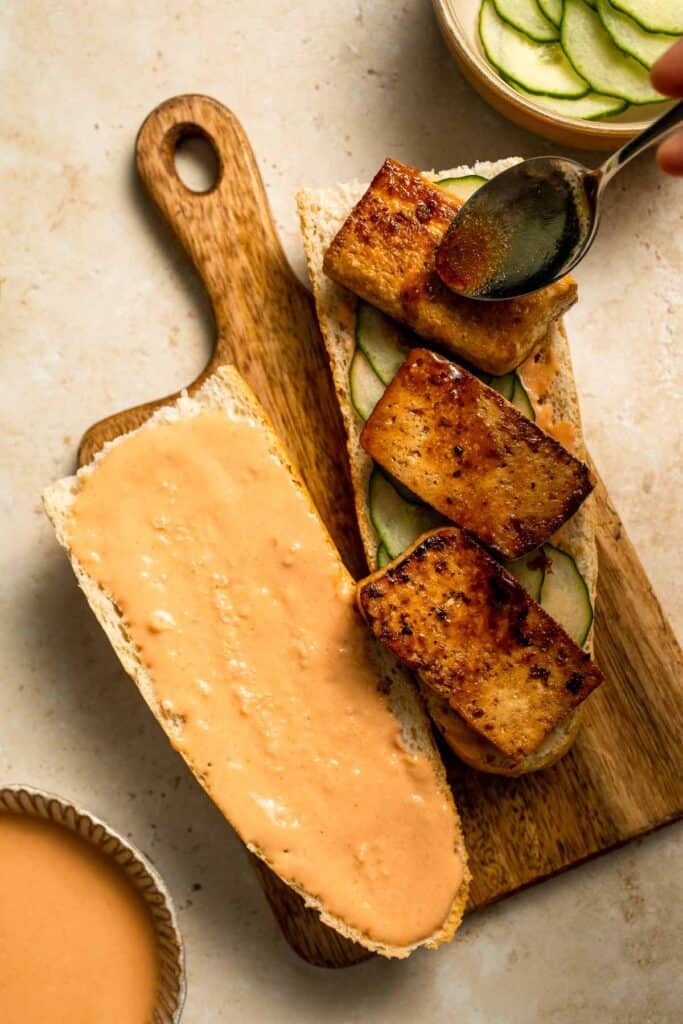 This flavorful Vegetarian Banh Mi Sandwich is made with crispy tofu, pickled vegetables, and sweet mayo layered inside a crusty baguette. | aheadofthyme.com