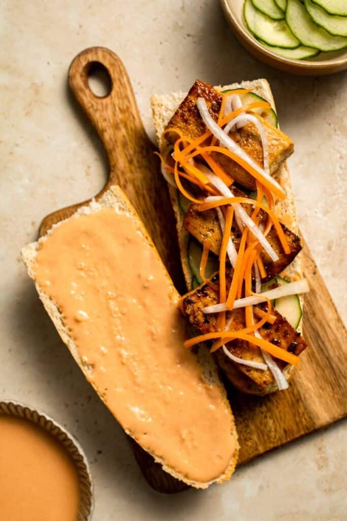 This flavorful Vegetarian Banh Mi Sandwich is made with crispy tofu, pickled vegetables, and sweet mayo layered inside a crusty baguette. | aheadofthyme.com