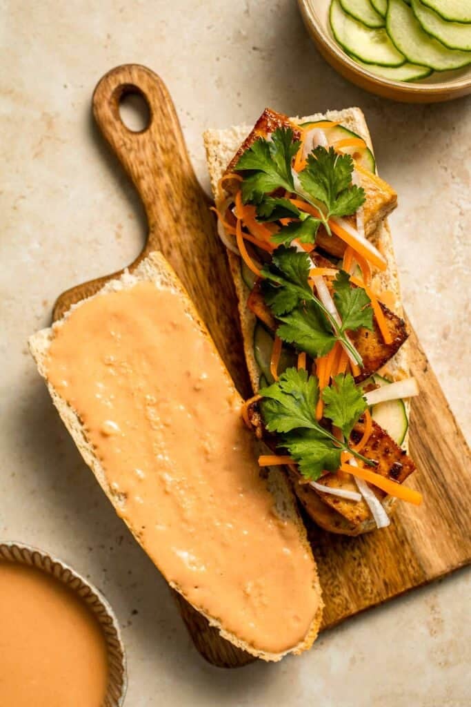 This flavorful Vegetarian Banh Mi Sandwich is made with crispy tofu, pickled vegetables, and sweet mayo layered inside a crusty baguette. | aheadofthyme.com
