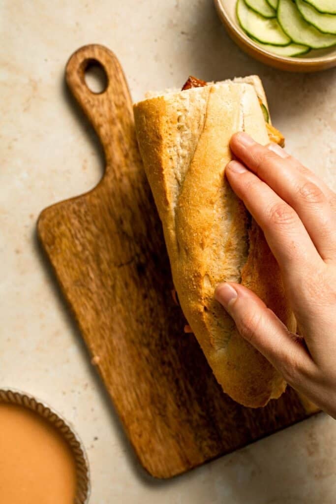 This flavorful Vegetarian Banh Mi Sandwich is made with crispy tofu, pickled vegetables, and sweet mayo layered inside a crusty baguette. | aheadofthyme.com