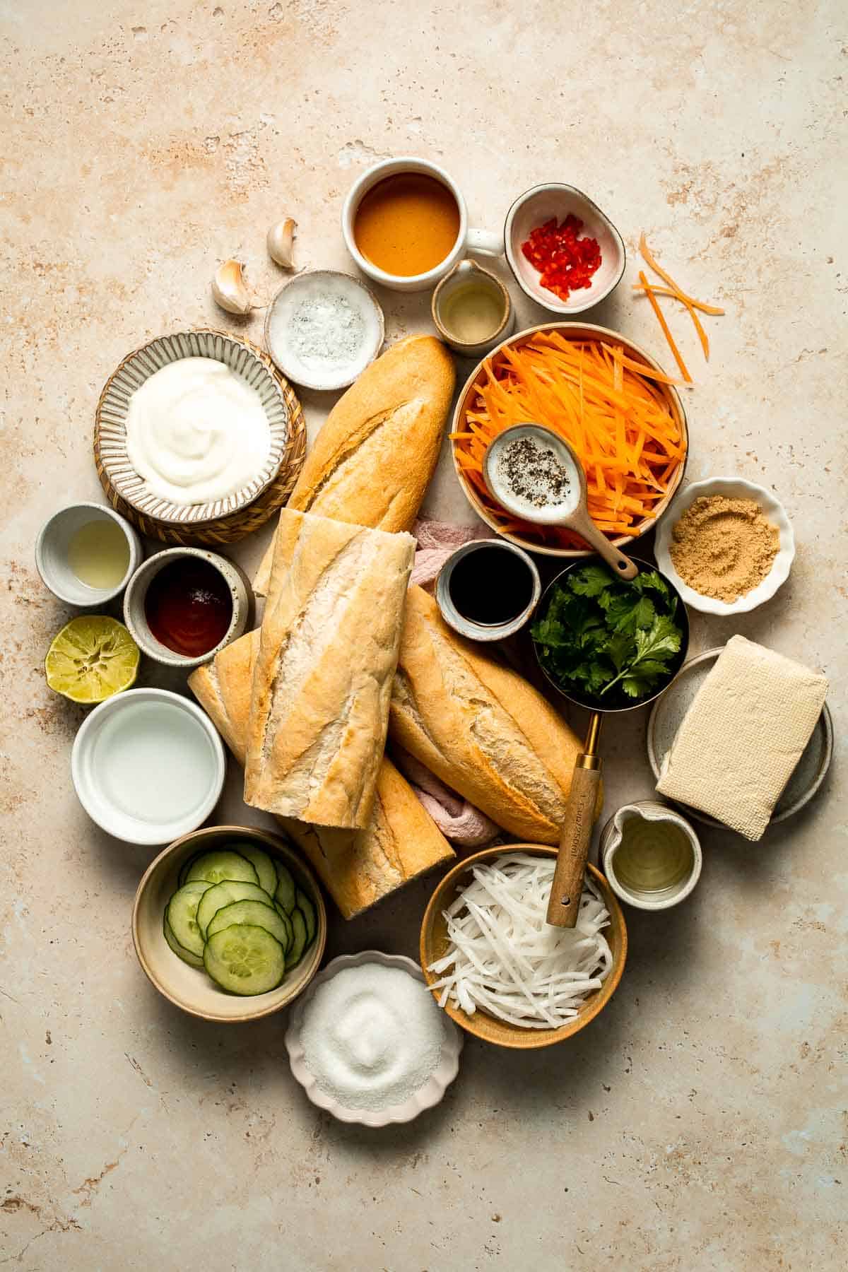 This flavorful Vegetarian Banh Mi Sandwich is made with crispy tofu, pickled vegetables, and sweet mayo layered inside a crusty baguette. | aheadofthyme.com