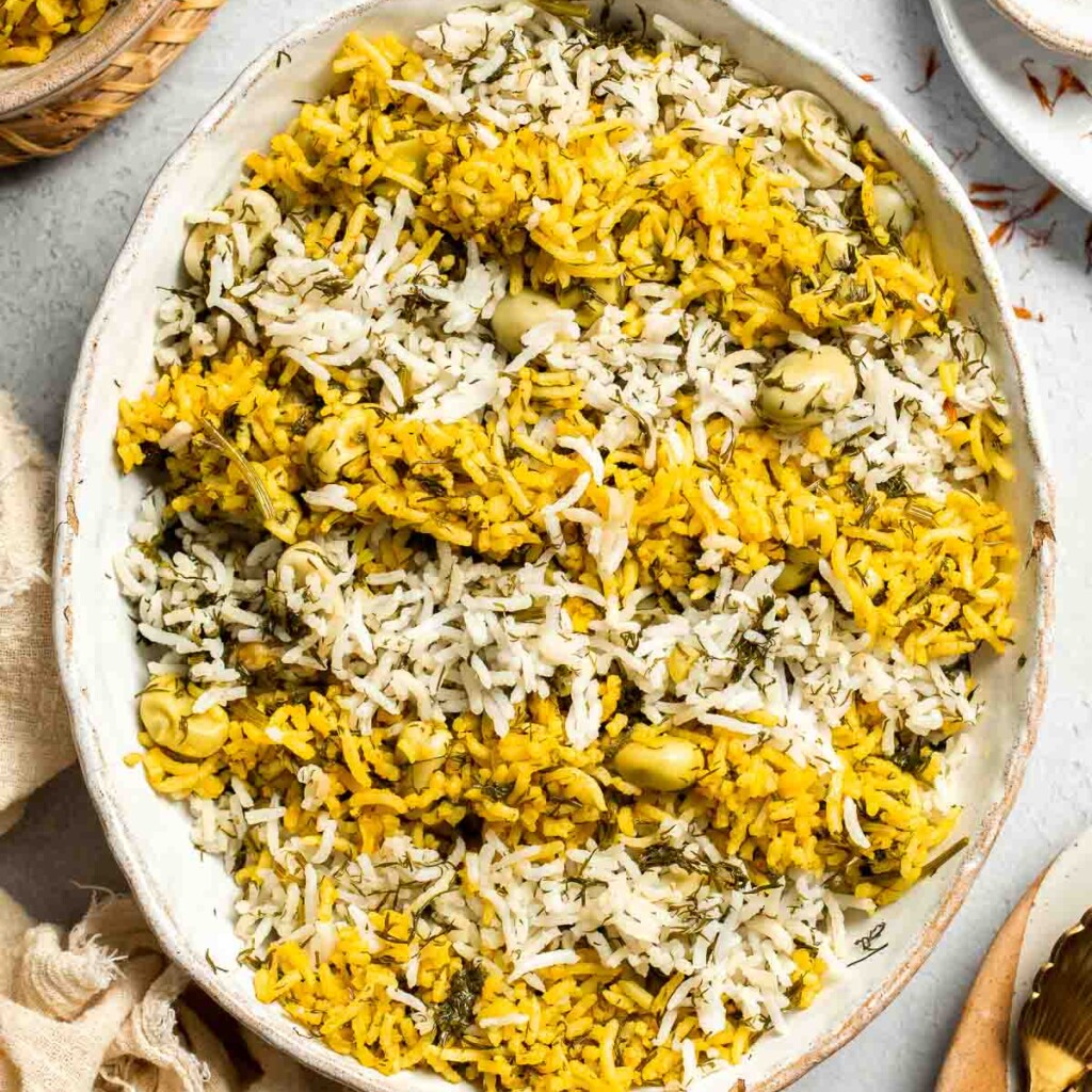 Baghali Polo is a traditional Persian dish made with fragrant basmati rice, dill, and tender fava beans. Learn how to make it with our easy recipe. | aheadofthyme.com