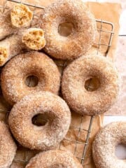 Indulge in the flavors of fall with these delicious baked apple cider donuts coated in spiced cinnamon sugar. An easy to make and cozy fall treat! | aheadofthyme.com