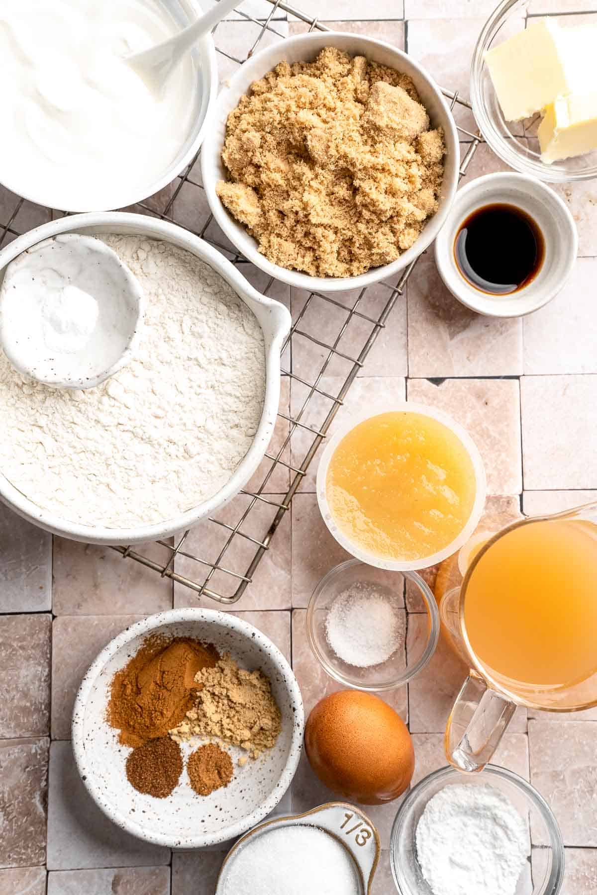 Indulge in the flavors of fall with these delicious baked apple cider donuts coated in spiced cinnamon sugar. An easy to make and cozy fall treat! | aheadofthyme.com