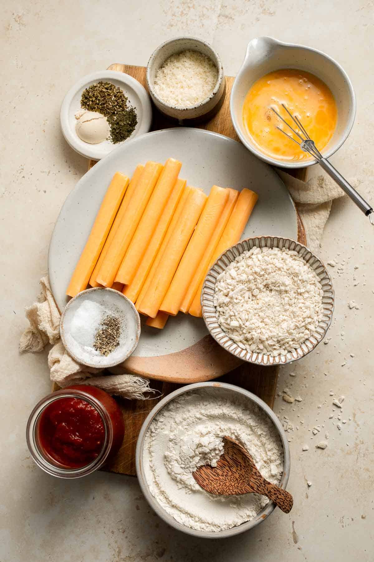 These delicious baked cheddar cheese sticks are the best snack or appetizer: crispy on the outside and gooey on the inside. Perfect for cheese lovers! | aheadofthyme.com