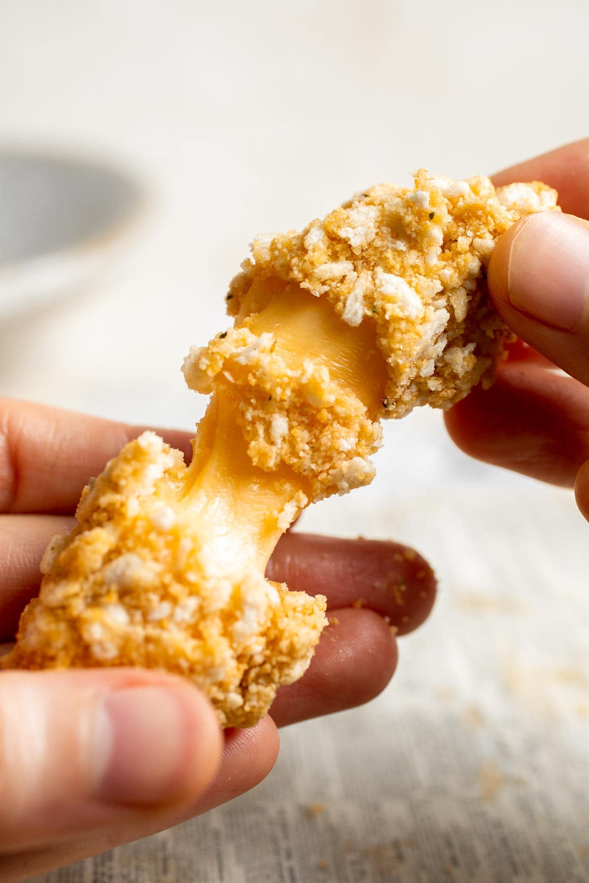 These delicious baked cheddar cheese sticks are the best snack or appetizer: crispy on the outside and gooey on the inside. Perfect for cheese lovers! | aheadofthyme.com