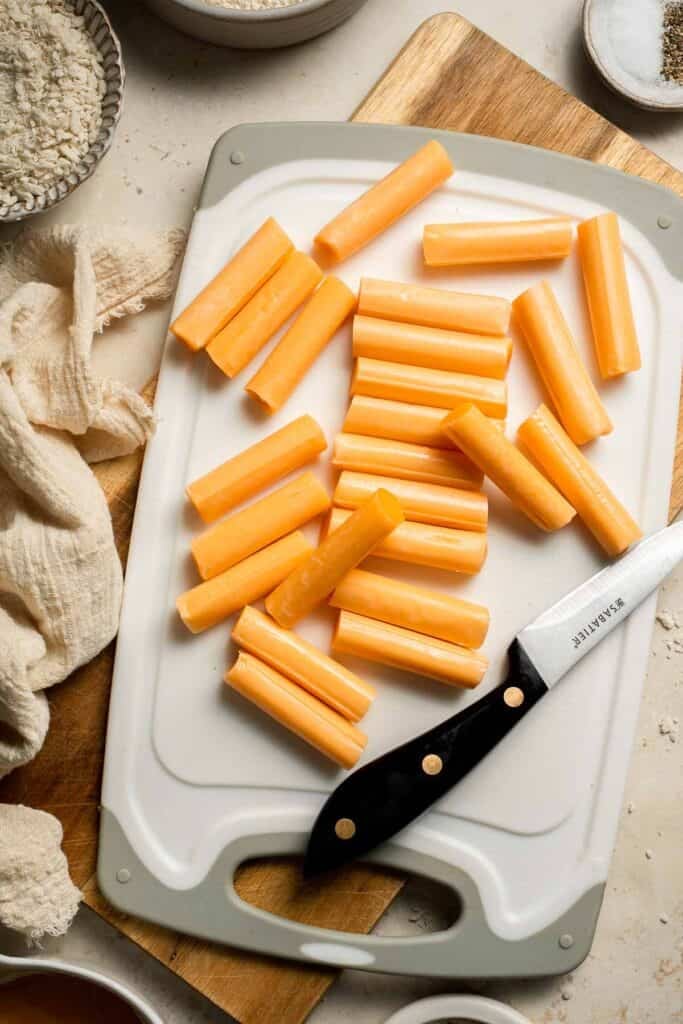 These delicious baked cheddar cheese sticks are the best snack or appetizer: crispy on the outside and gooey on the inside. Perfect for cheese lovers! | aheadofthyme.com