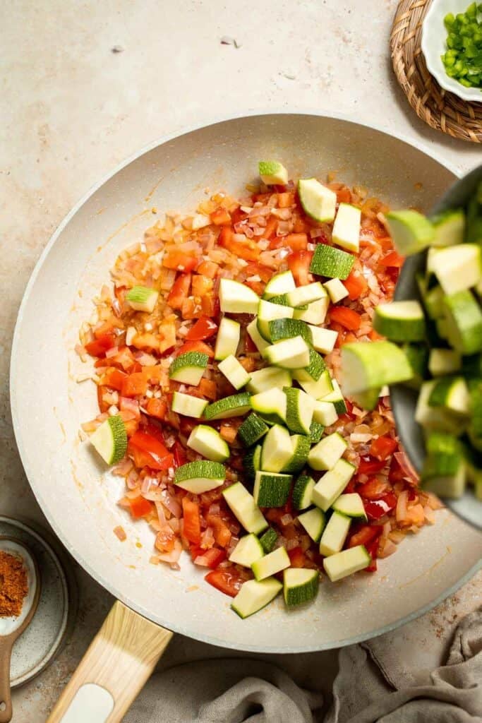 Calabacitas (Mexican Zucchini) is a traditional side dish made with zucchini, corn, tomatoes, and peppers. Make these colorful veggies in just 20 minutes. | aheadofthyme.com
