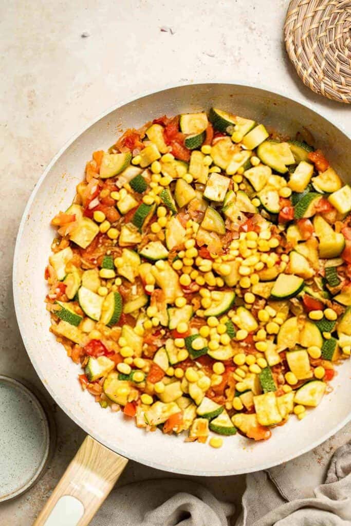 Calabacitas (Mexican Zucchini) is a traditional side dish made with zucchini, corn, tomatoes, and peppers. Make these colorful veggies in just 20 minutes. | aheadofthyme.com