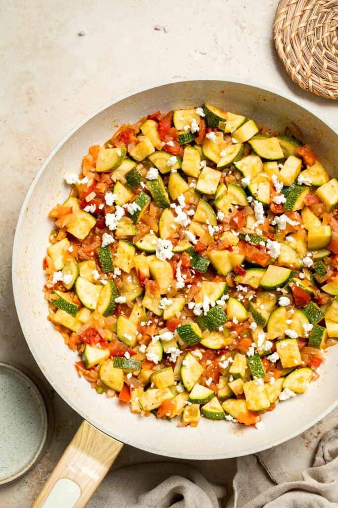 Calabacitas (Mexican Zucchini) is a traditional side dish made with zucchini, corn, tomatoes, and peppers. Make these colorful veggies in just 20 minutes. | aheadofthyme.com