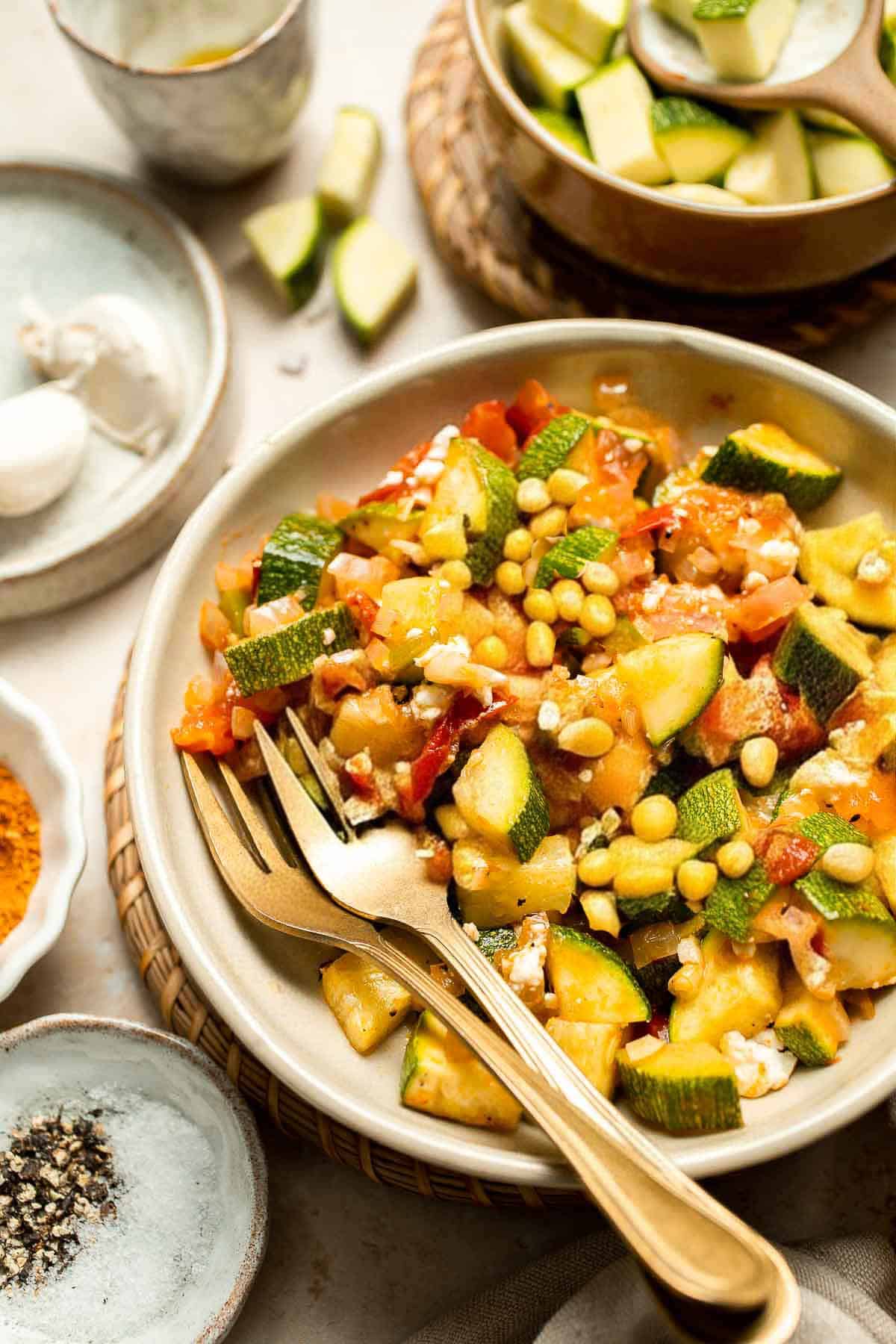 Calabacitas (Mexican Zucchini) is a traditional side dish made with zucchini, corn, tomatoes, and peppers. Make these colorful veggies in just 20 minutes. | aheadofthyme.com