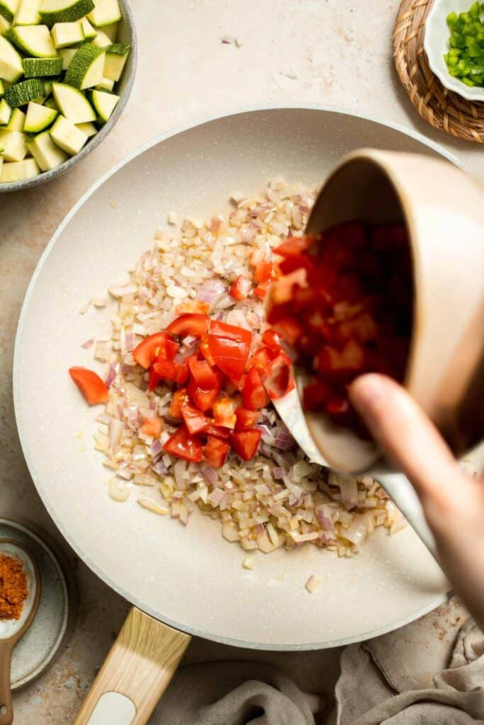 Calabacitas (Mexican Zucchini) is a traditional side dish made with zucchini, corn, tomatoes, and peppers. Make these colorful veggies in just 20 minutes. | aheadofthyme.com