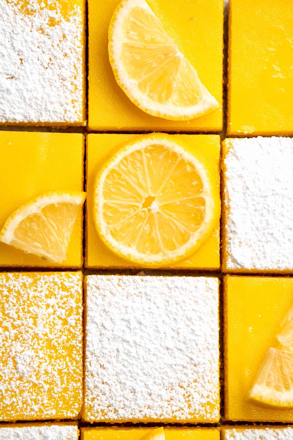 These Classic Lemon Bars with a buttery shortbread crust and tangy lemon curd layer are the perfect balance of sweet and tart. A simple, delicious treat! | aheadofthyme.com