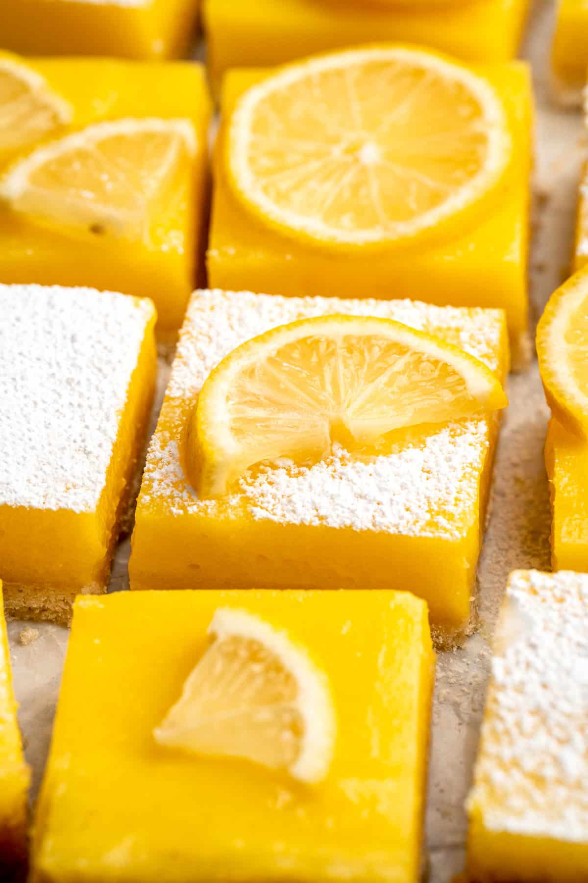These Classic Lemon Bars with a buttery shortbread crust and tangy lemon curd layer are the perfect balance of sweet and tart. A simple, delicious treat! | aheadofthyme.com