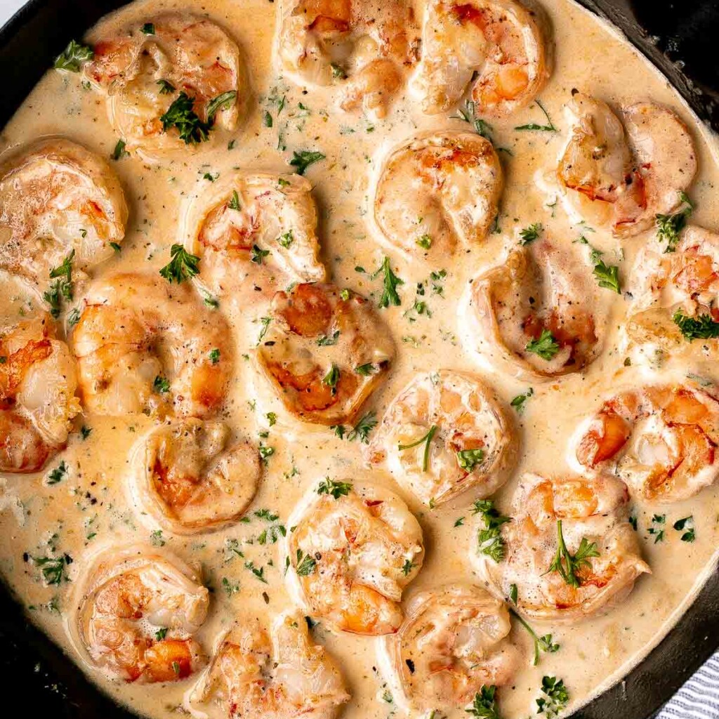 Creamy Garlic Shrimp is a quick and easy 15-minute meal made with juicy shrimp in a cheesy garlic cream sauce. Perfect for weeknight dinners! | aheadofthyme.com