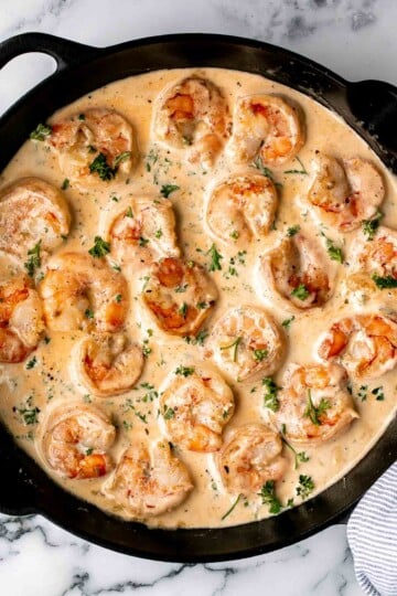 Creamy Garlic Shrimp is a quick and easy 15-minute meal made with juicy shrimp in a cheesy garlic cream sauce. Perfect for weeknight dinners! | aheadofthyme.com