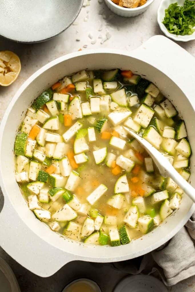 This Creamy Zucchini Soup is made without using cream (using secret ingredient white beans!). It's smooth, healthy, flavorful, vegan, and dairy-free. | aheadofthyme.com