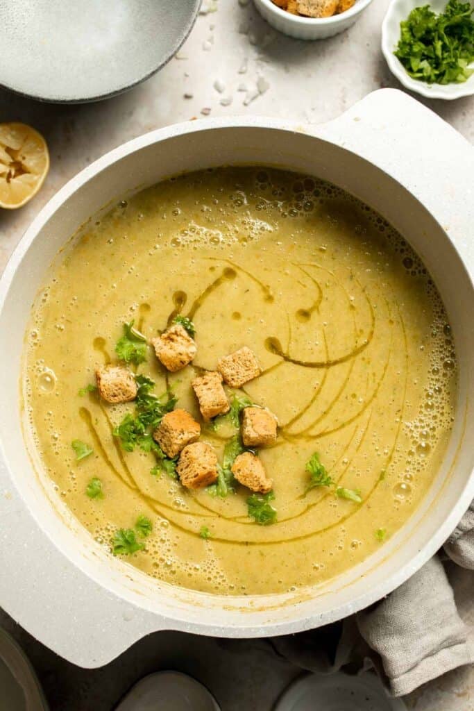 This Creamy Zucchini Soup is made without using cream (using secret ingredient white beans!). It's smooth, healthy, flavorful, vegan, and dairy-free. | aheadofthyme.com