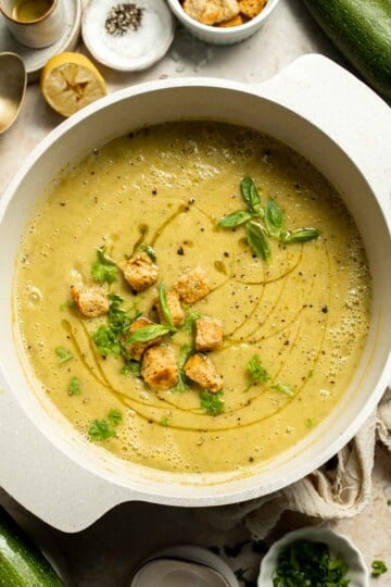 This Creamy Zucchini Soup is made without using cream (using secret ingredient white beans!). It's smooth, healthy, flavorful, vegan, and dairy-free. | aheadofthyme.com