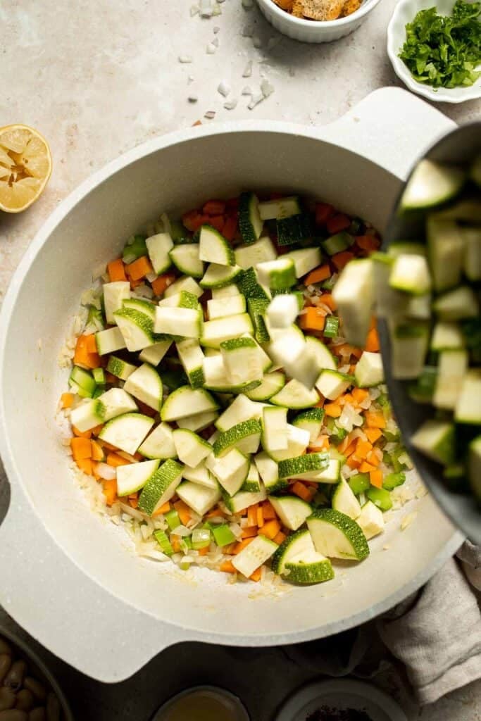 This Creamy Zucchini Soup is made without using cream (using secret ingredient white beans!). It's smooth, healthy, flavorful, vegan, and dairy-free. | aheadofthyme.com