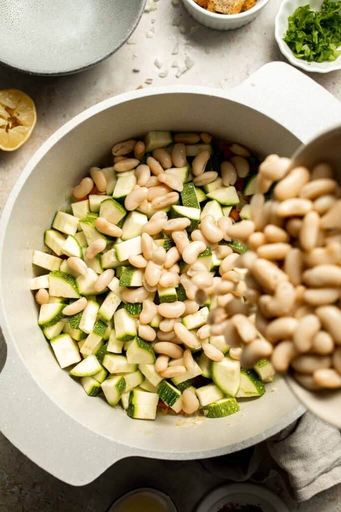 This Creamy Zucchini Soup is made without using cream (using secret ingredient white beans!). It's smooth, healthy, flavorful, vegan, and dairy-free. | aheadofthyme.com