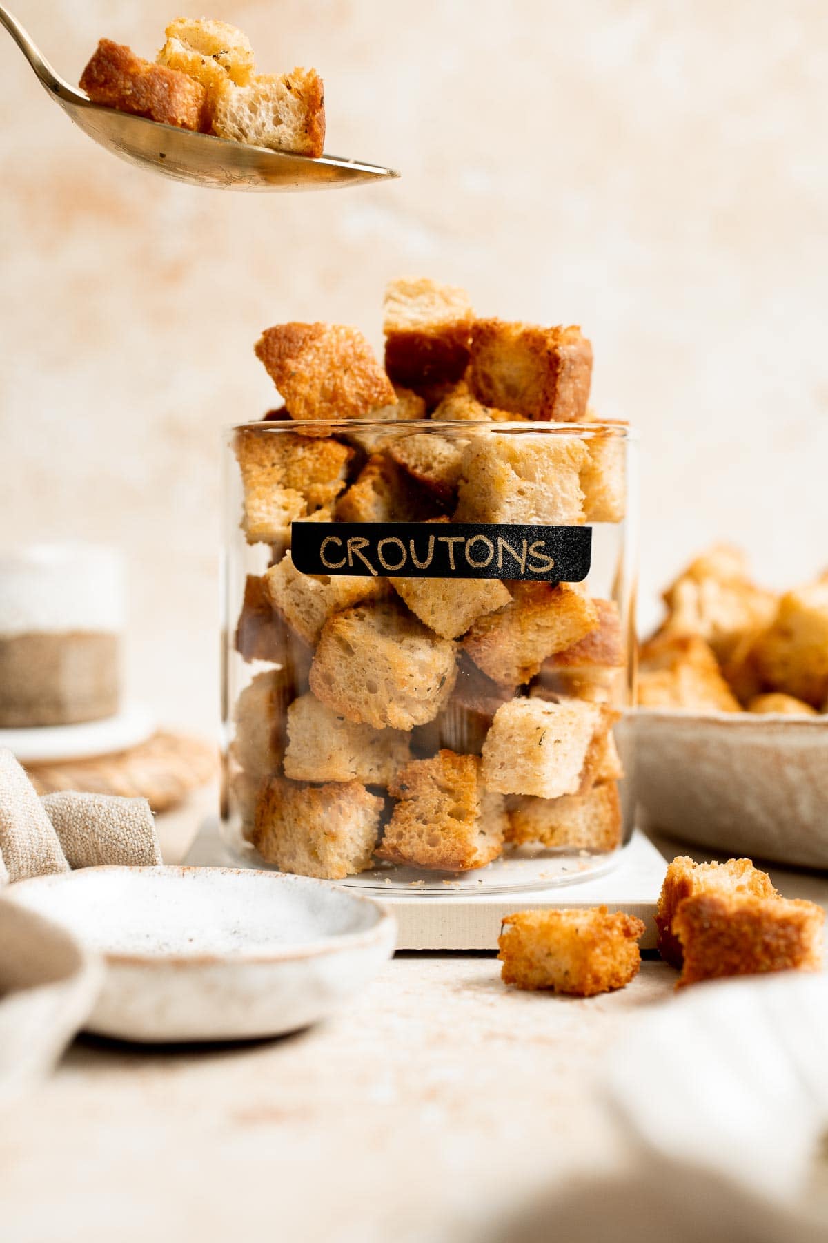 Looking for a simple and delicious way to use up leftover bread? Try this easy homemade croutons recipe that will elevate any salad or soup. | aheadofthyme.com